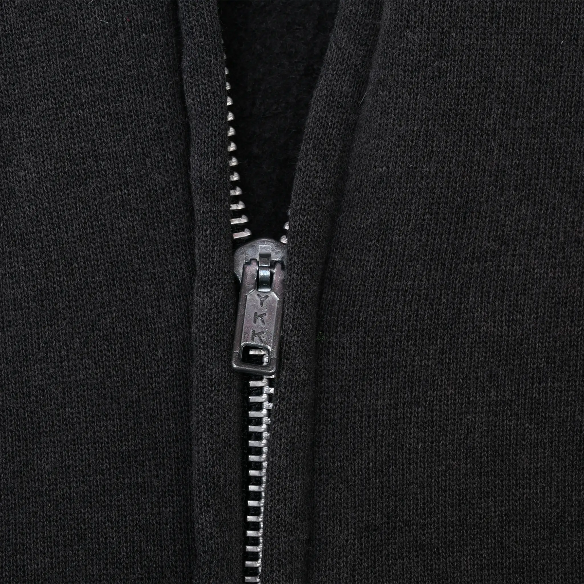 Close-up of metal zipper and black fabric on Harley-Davidson hoodie