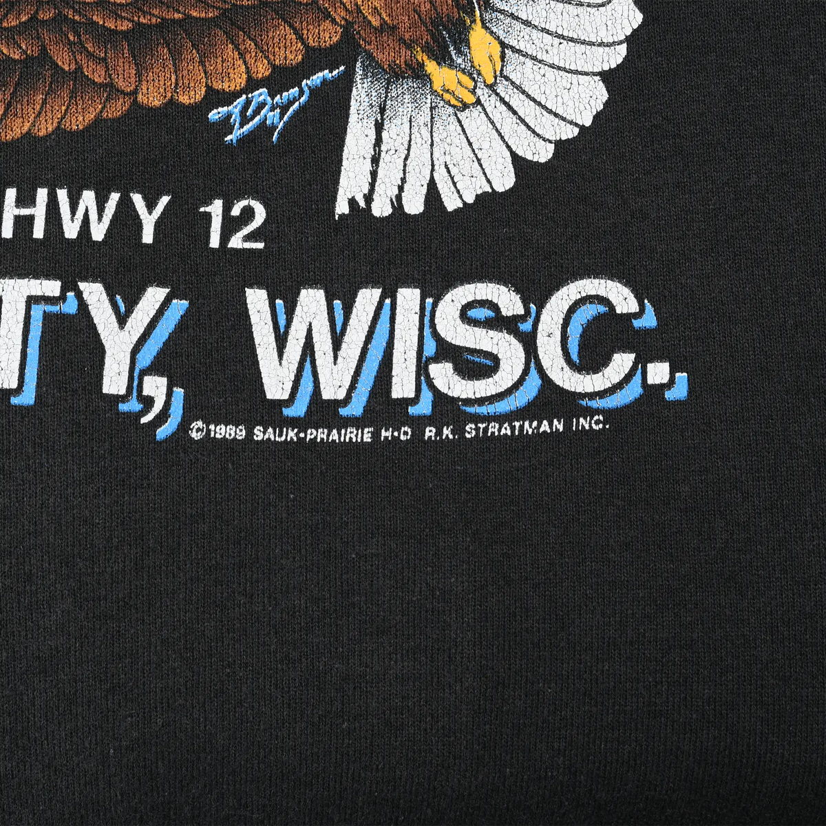 Close-up of Sauk City, Wisconsin graphic with Highway 12 text, eagle detail, and 1989 copyright