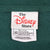 The Disney Store neck and care labels showing size XXL