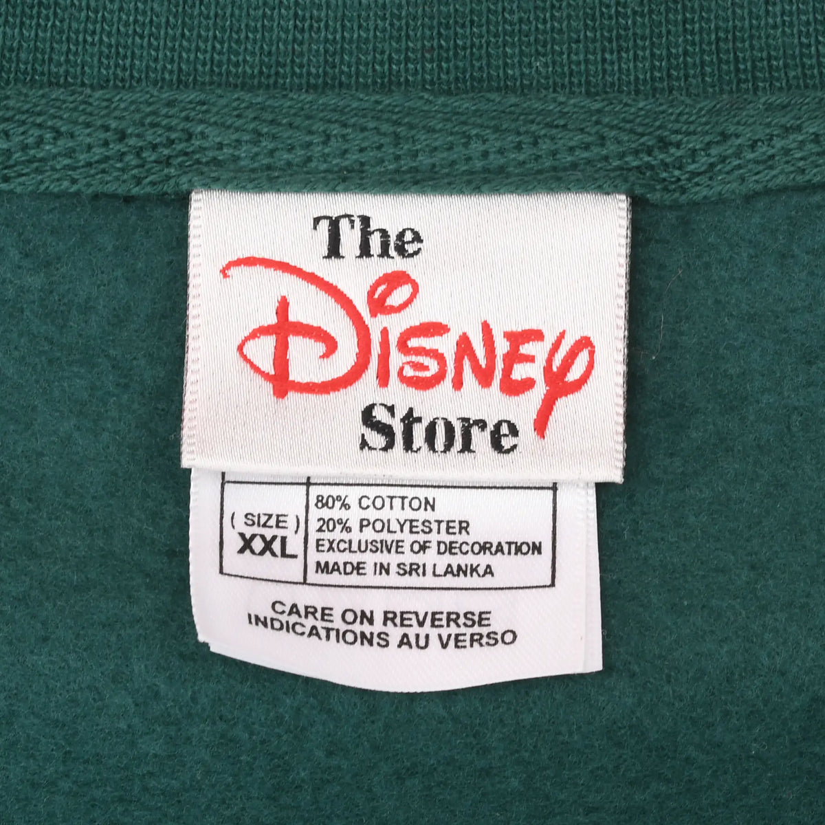 The Disney Store neck and care labels showing size XXL