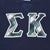 Close-up of plaid Epsilon Kappa letter appliqué on navy sweatshirt