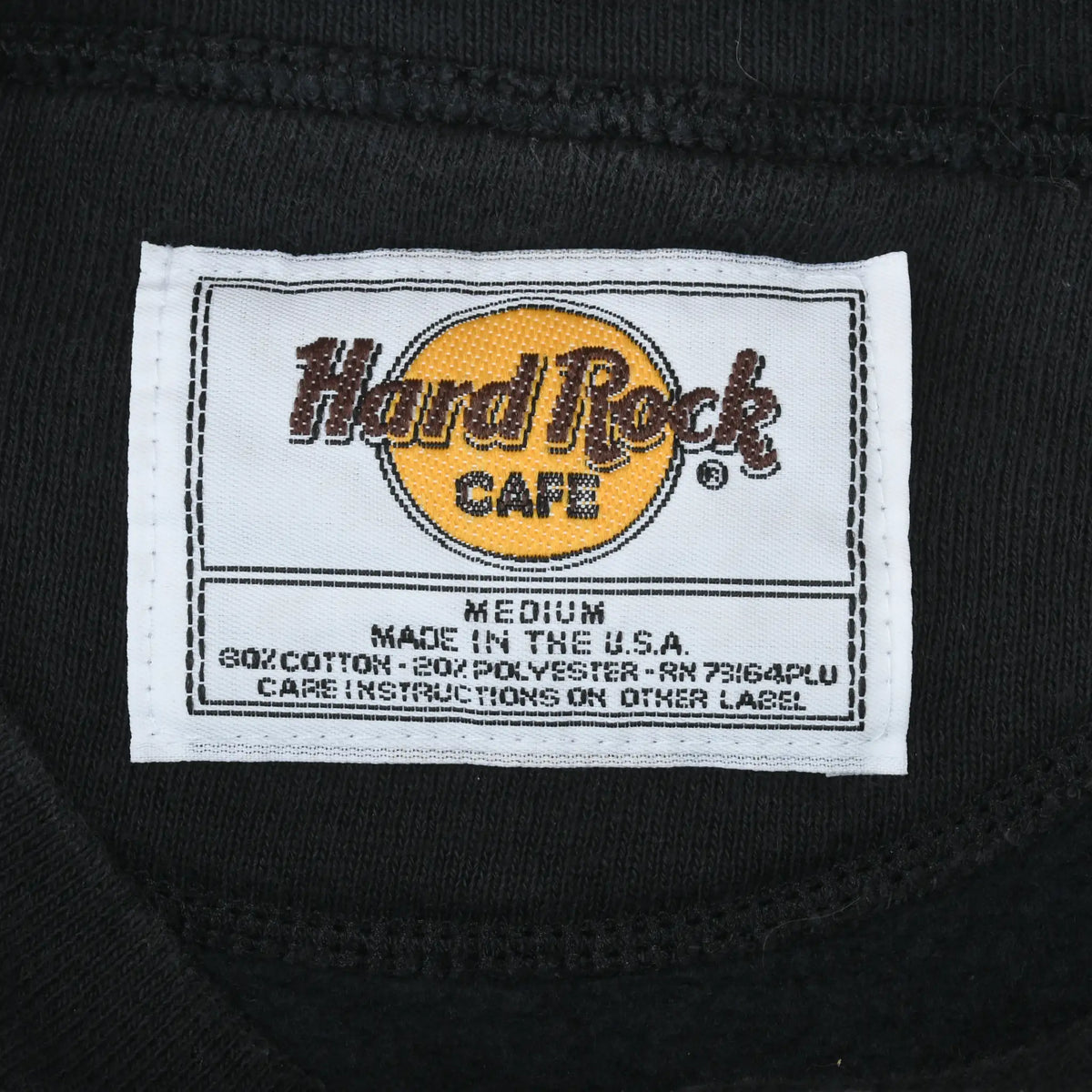 Hard Rock Cafe neck label marked medium, made in USA, and 80% cotton 20% polyester
