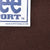 Close-up of brown sweatshirt fabric and Lee Sport hangtag with 1999 licensee text