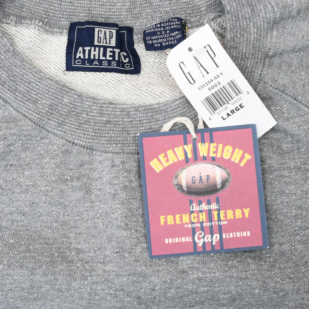 Close-up of Gap Athletics Classic neck label and attached Large retail tags