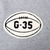 Close-up of cream football-shaped G-35 chest patch on grey sweatshirt