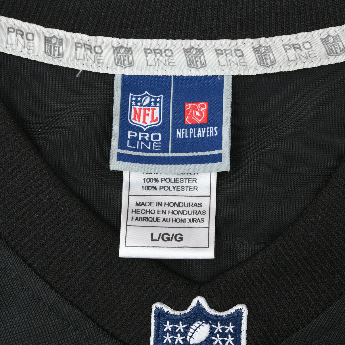 Close-up of NFL Pro Line and NFL Players neck labels on black jersey