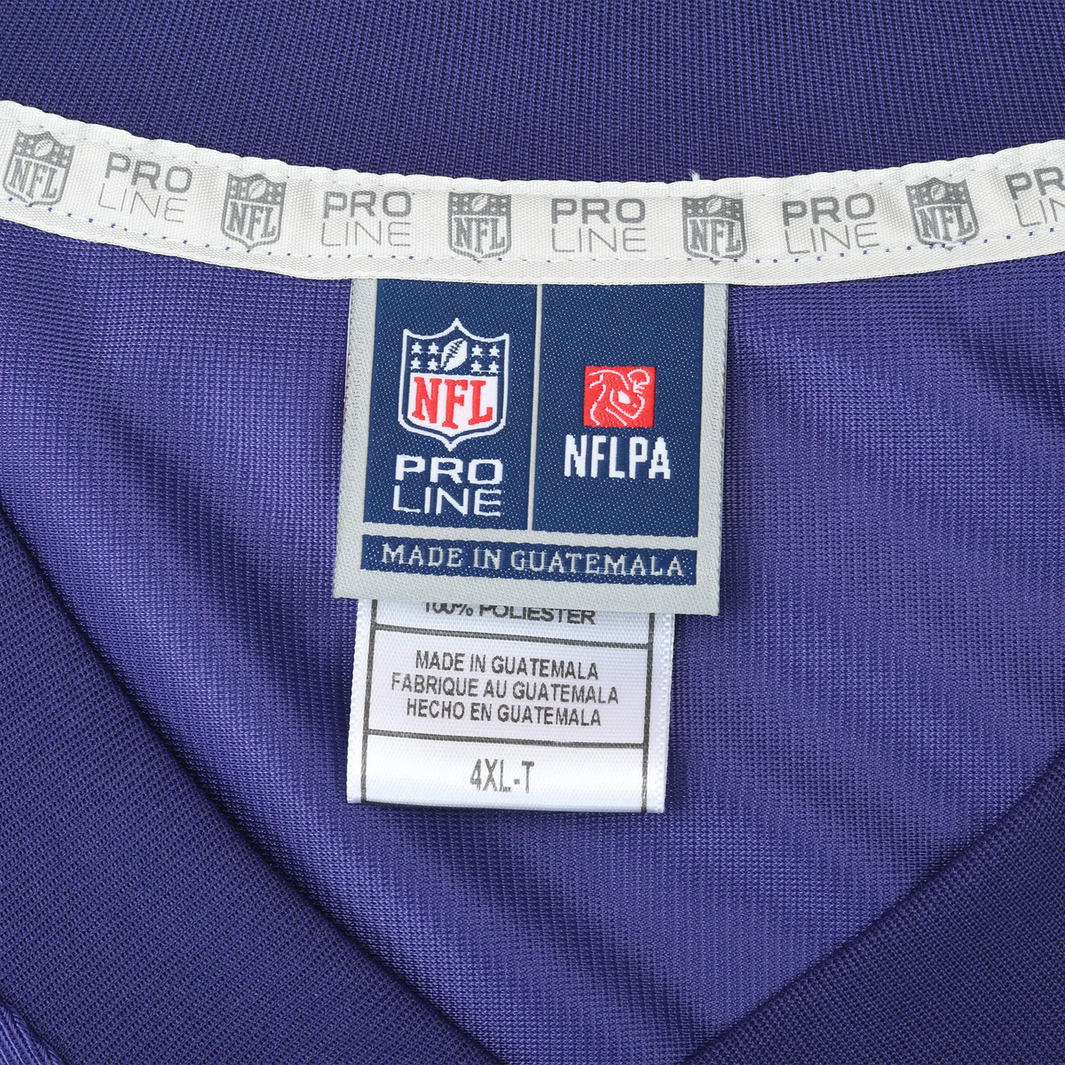 Close-up of NFL Pro Line and NFLPA neck labels marked 4XL-T