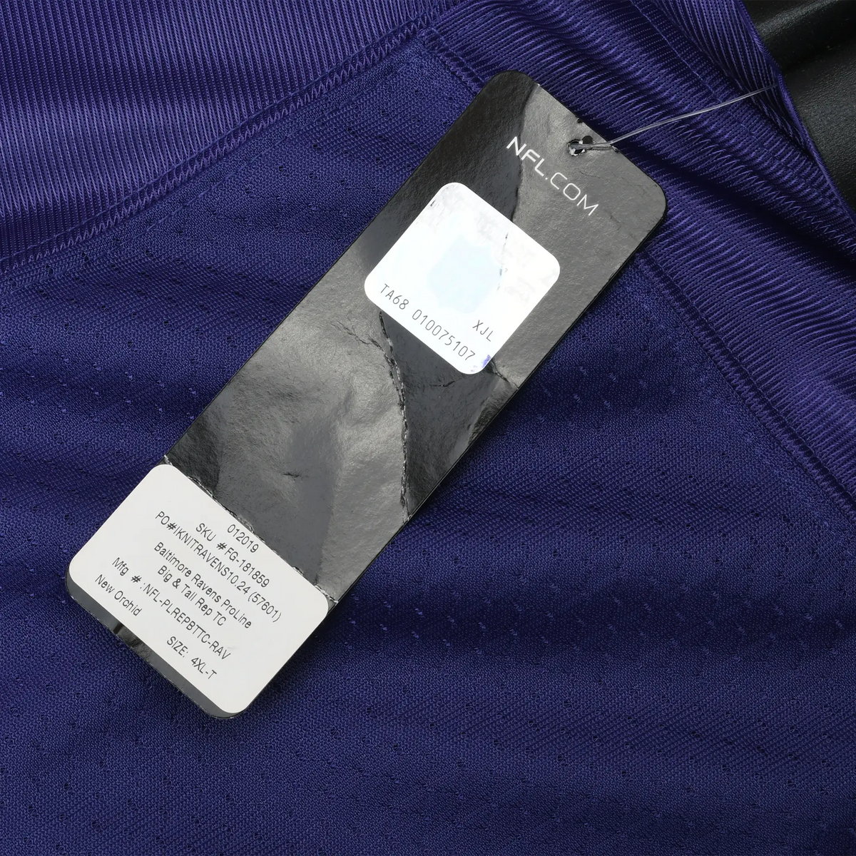 NFL.com retail hang tag attached to purple jersey fabric