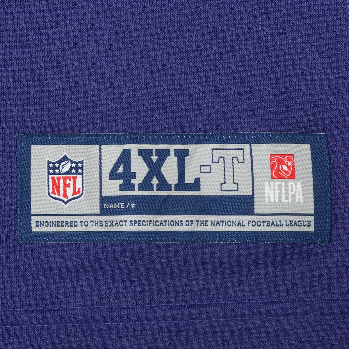 Close-up of NFL and NFLPA jersey hem label marked 4XL-T