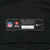 Close-up of NFL, NFLPA and Nike engineered hem label on black jersey fabric