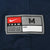 Nike Team medium jock tag stitched near the hem of navy BYU football jersey