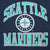 Close-up of teal and white Seattle Mariners lettering and compass logo