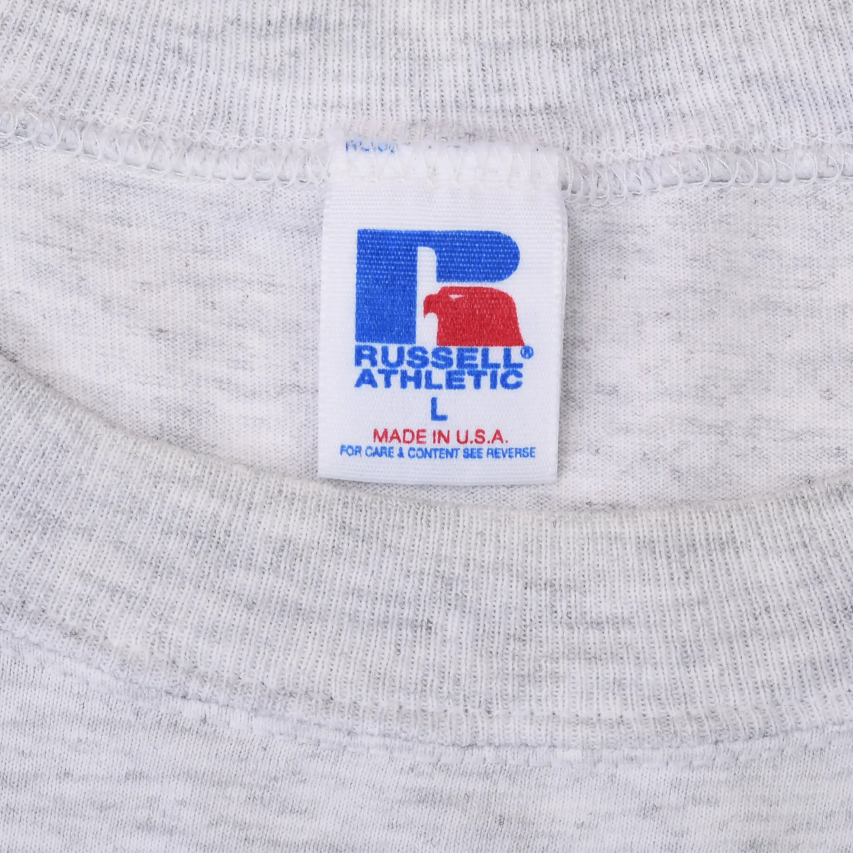 Russell Athletic neck tag marked size L and Made in U.S.A. on grey T-shirt