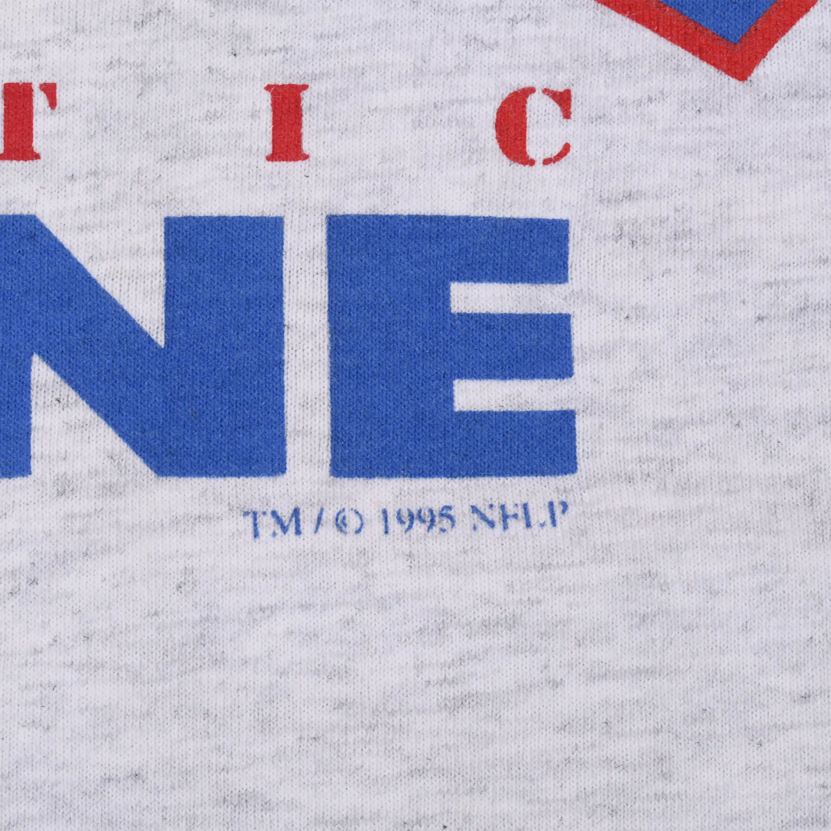 Close-up of NFL Pro Line print showing TM copyright 1995 NFLP detail