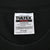 Close-up of Tultex neck label marked cotton, preshrunk, and size X-Large