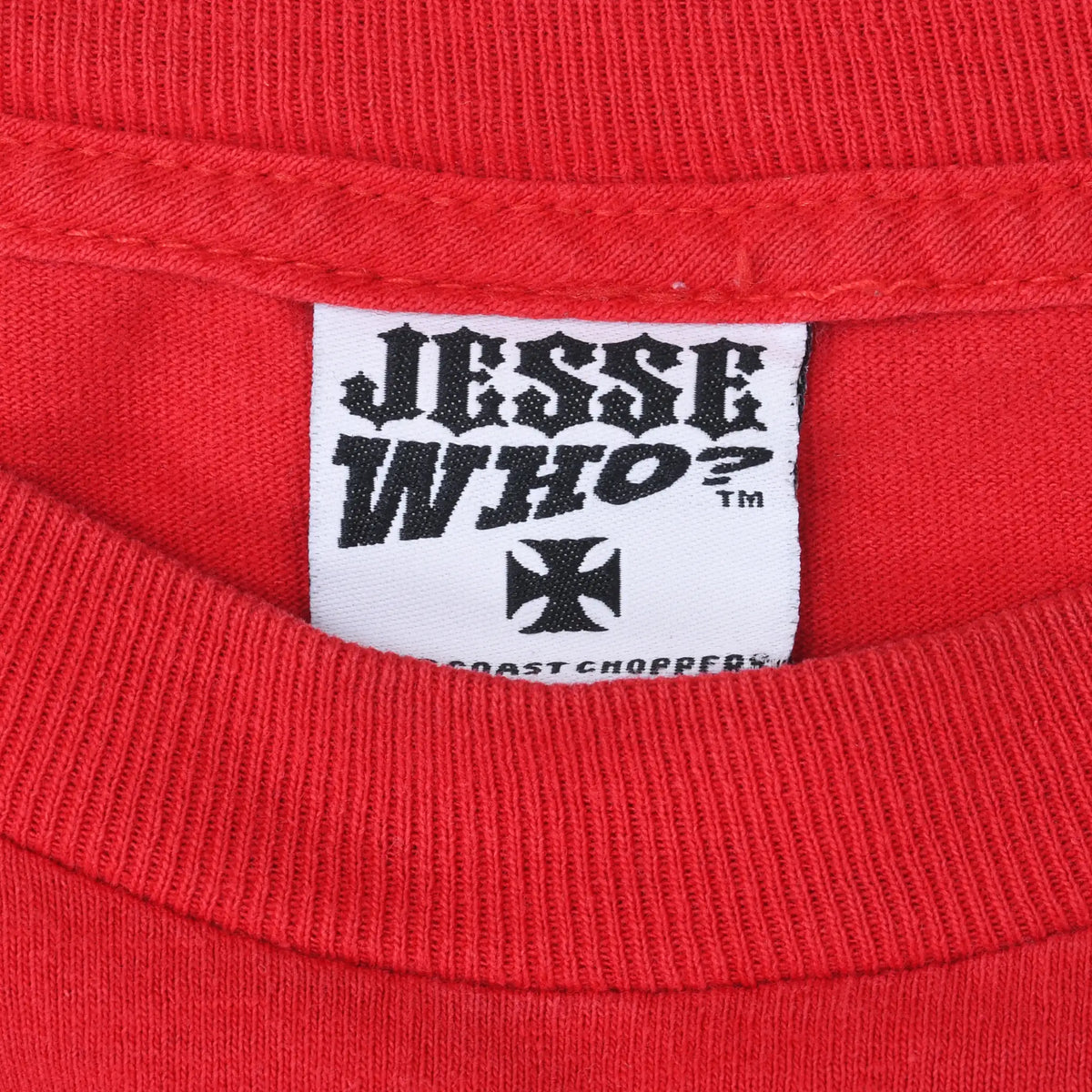 Close-up of Jesse Who West Coast Choppers neck label inside red T-shirt