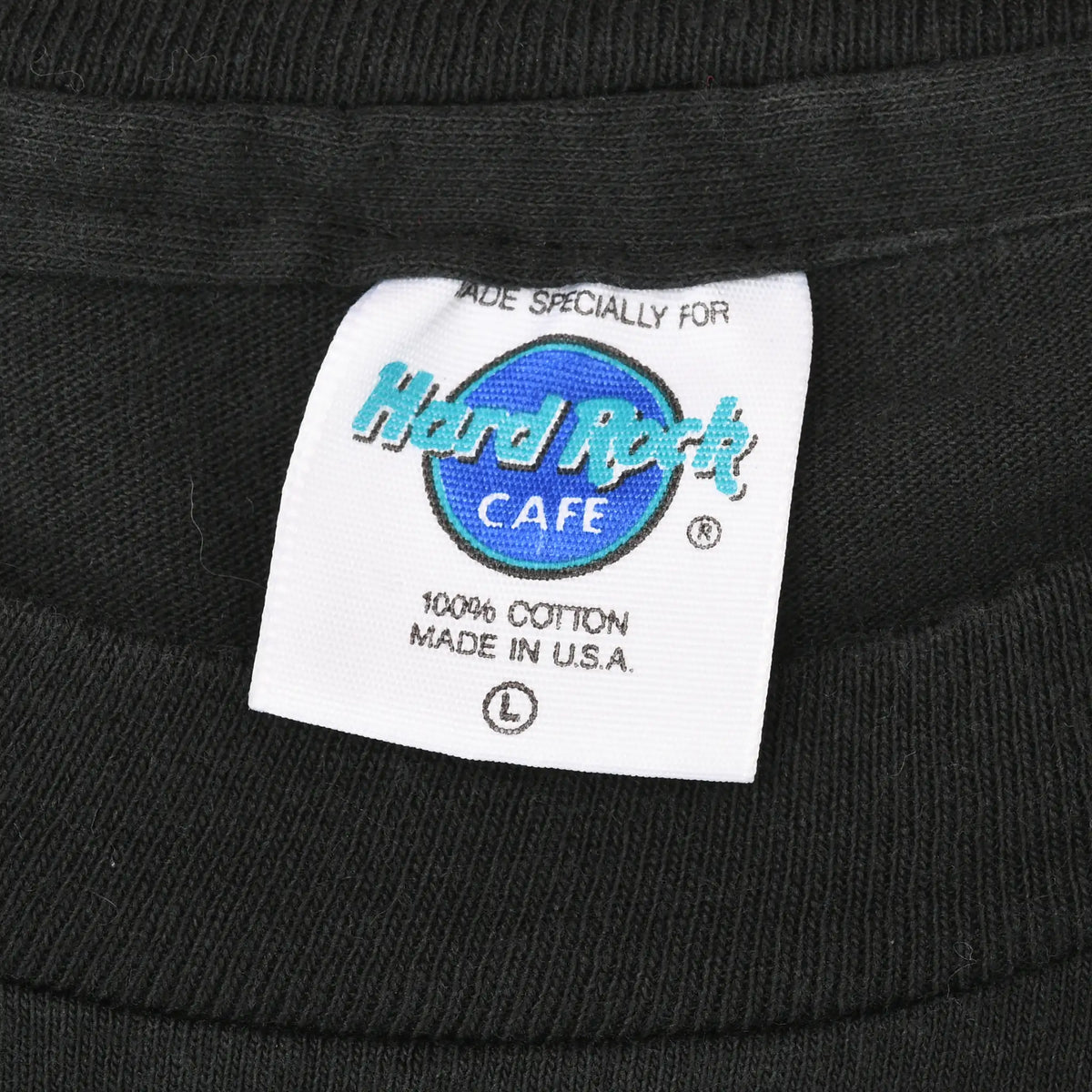 Hard Rock Cafe neck tag marked 100% cotton, made in U.S.A., and size large