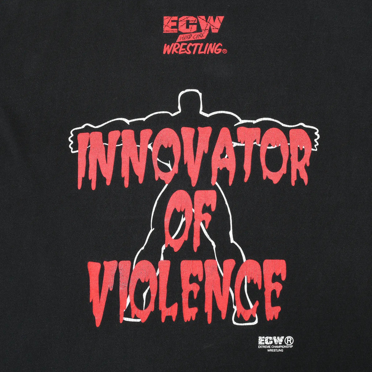 Close-up of back print with red Innovator of Violence text over a wrestler silhouette