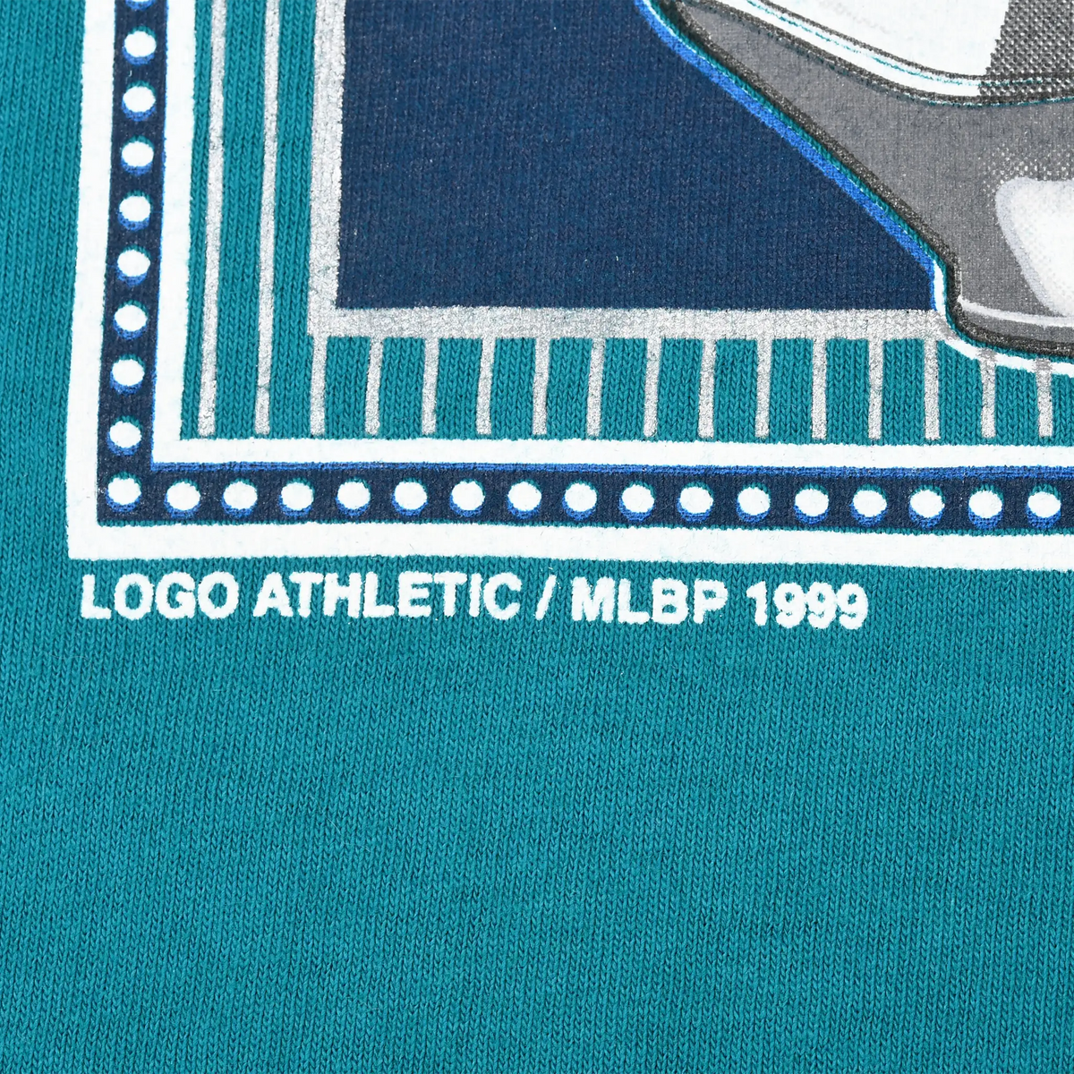 Close-up of Logo Athletic and MLBP 1999 copyright text beneath front graphic