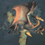 Close-up of multicolor fire-breathing dragon print on blue-gray fabric