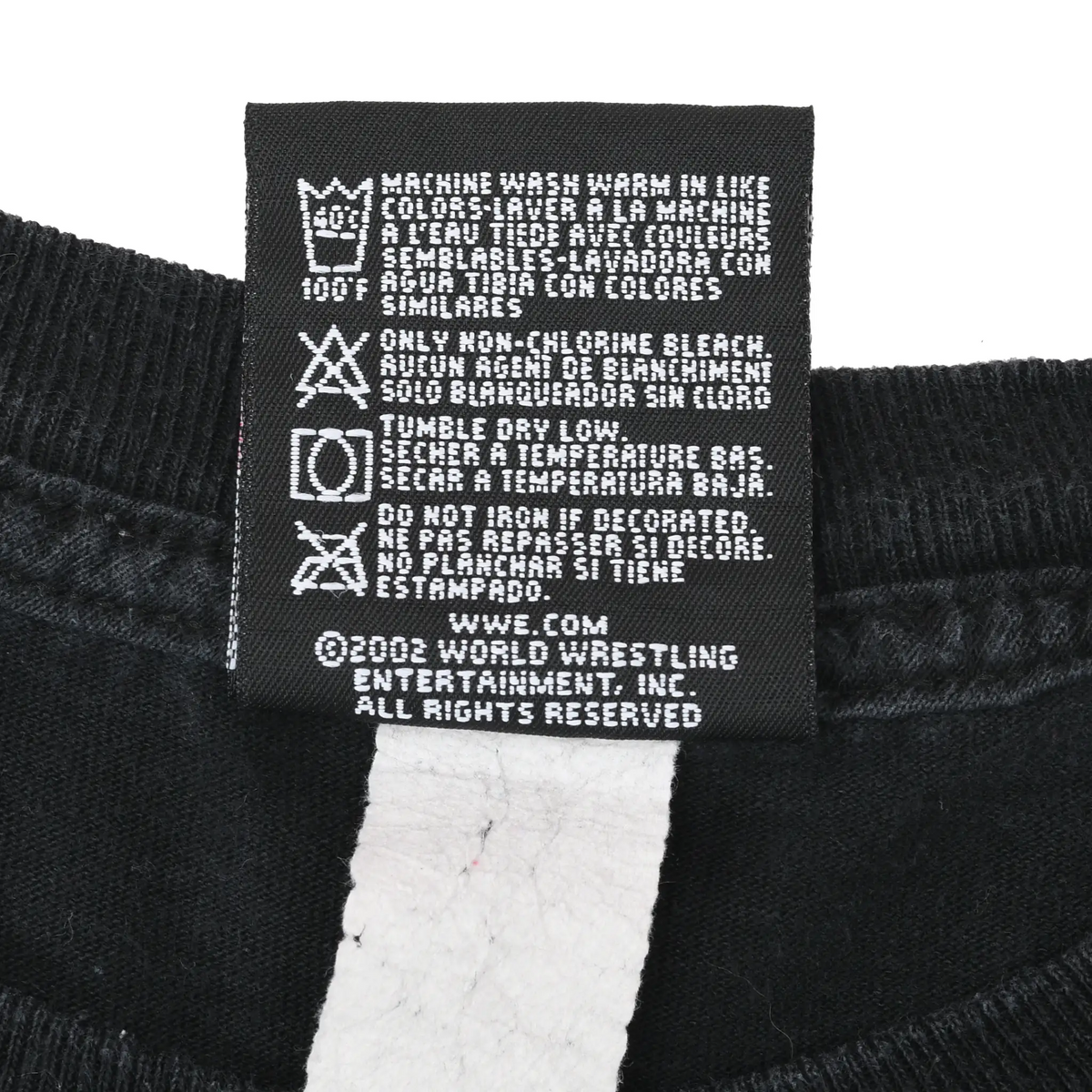 Close-up of WWE garment care label with washing instructions