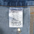 Interior Carhartt label showing B73-DST, 31 x 34, loose original fit, and 100% cotton