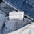 Close-up of interior Levi's production label printed with codes and 100% cotton