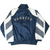 Back of navy and white New York Yankees windbreaker with Yankees lettering and striped sleeves