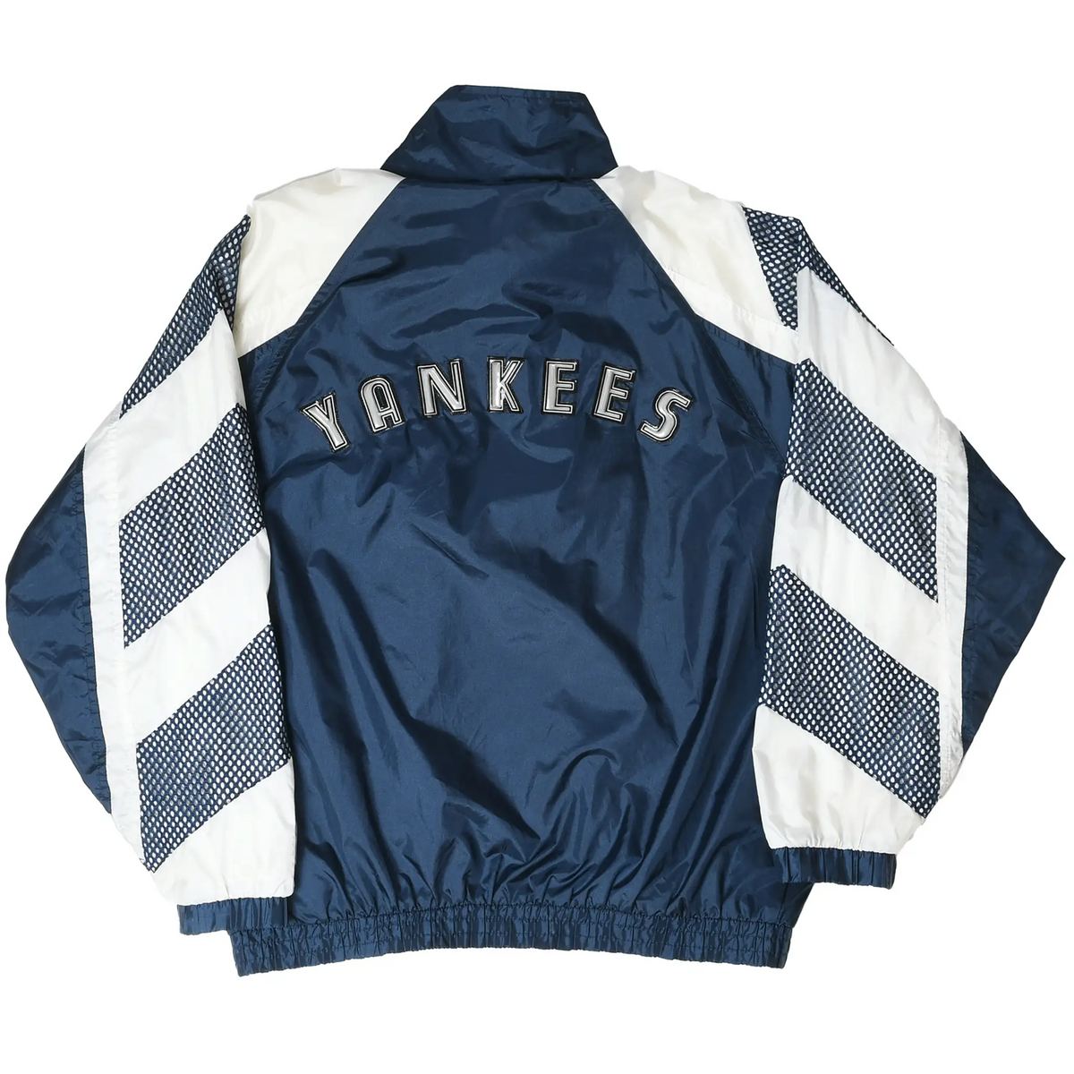 Back of navy and white New York Yankees windbreaker with Yankees lettering and striped sleeves