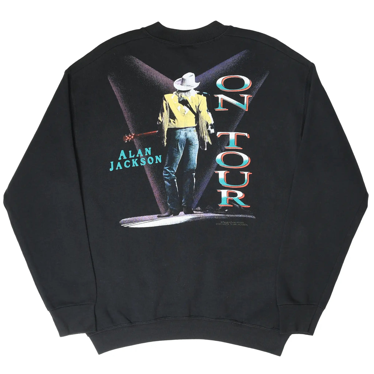 Back of black Alan Jackson sweatshirt with singer under spotlights and vertical On Tour text