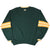 Back of green Green Bay Packers sweatshirt with small G logo below the collar and striped sleeves