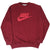 Full front view of burgundy Nike sweatshirt with red spellout and Swoosh logo