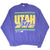 Full front view of purple Utah Jazz crewneck sweatshirt with multicolor logo print