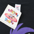 Close-up of Looney Tunes hangtag and Sherry's Best neck label on black T-shirt