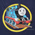 Close-up of back graphic showing Thomas the Tank Engine on rails within a yellow circle