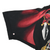 Close-up of black sleeve with red cape print and a small hole near the lower left