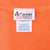 Close-up of NASCAR Chase Authentics neck label marked XL on orange fabric