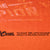 Close-up of Chase Authentics and Tony Stewart copyright print on orange fabric