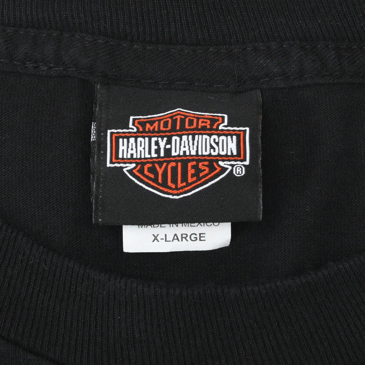 Harley-Davidson neck tag and X-Large size label inside black T-shirt