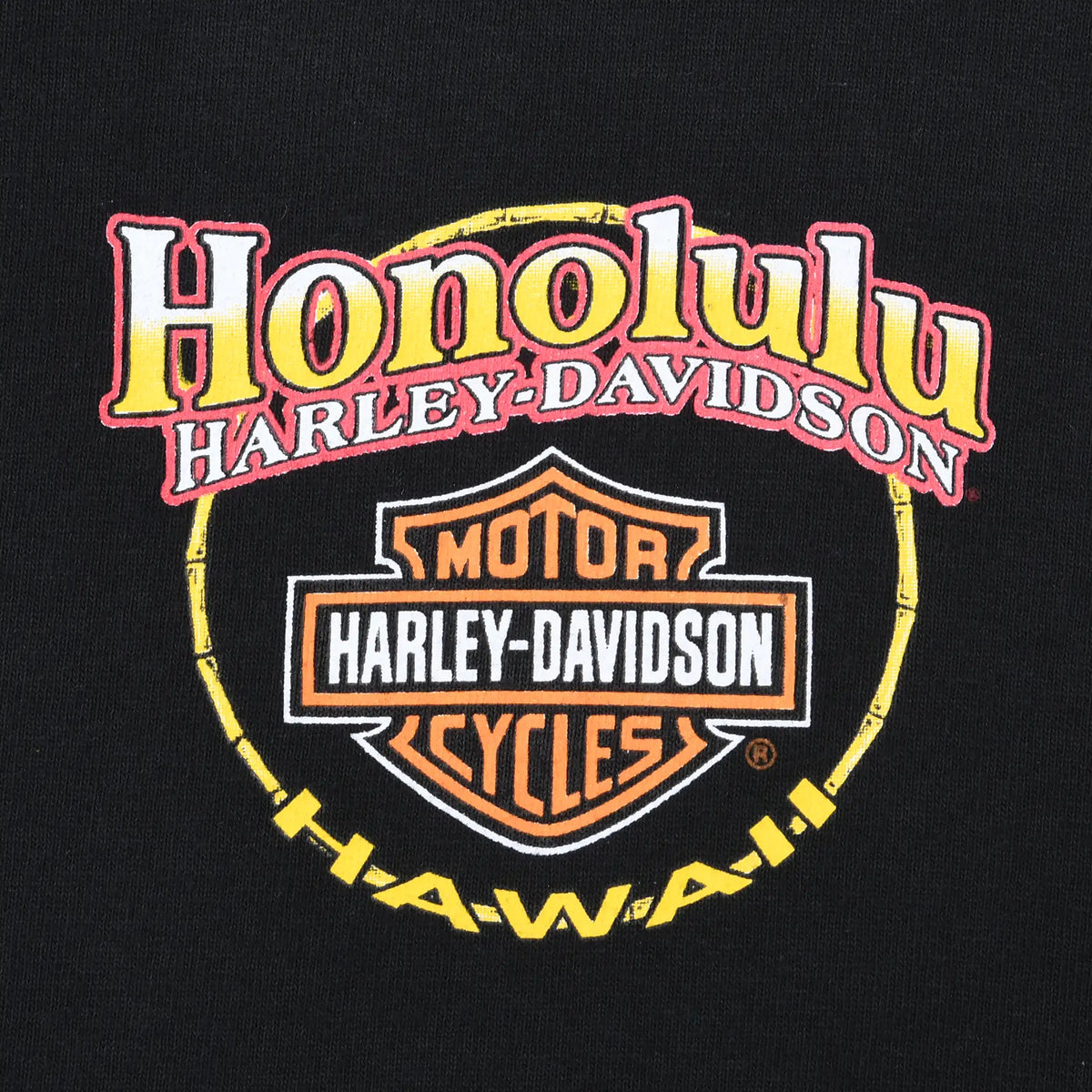 Close-up of Honolulu Hawaii Harley-Davidson chest logo print on black fabric