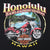 Close-up of Honolulu Hawaii back graphic with red Harley-Davidson motorcycle and tropical beach