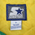 Starter brand label and XL care tag on yellow quilted jacket lining