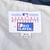 Close-up of MLB Genuine Merchandise and Pro Player neck labels inside the Yankees jacket