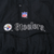 Close-up of embroidered NFL shield, Steelers name, and team logo on front pocket flap