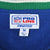 Close-up of NFL Pro Line Starter label and medium size tag inside the fleece jacket