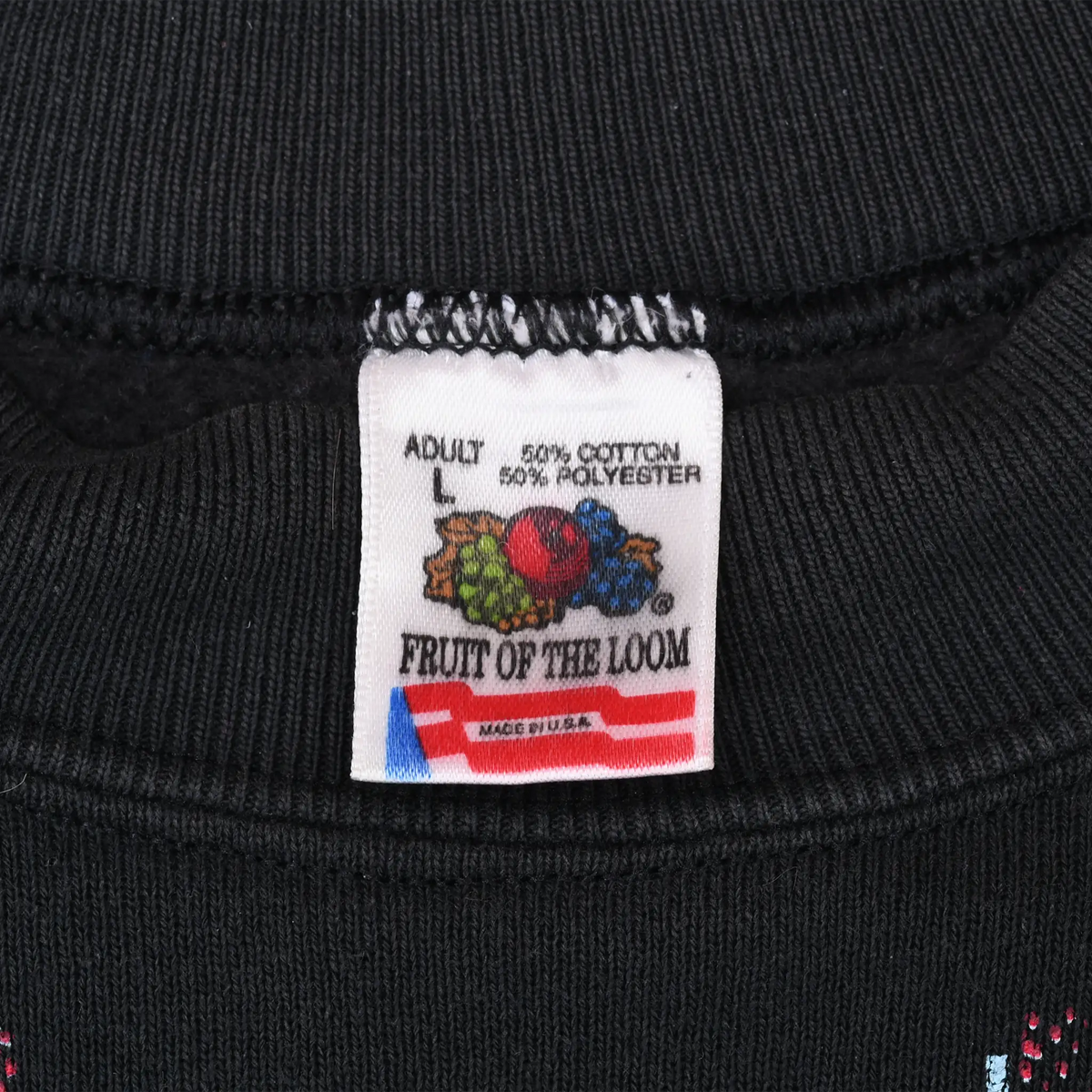 Fruit of the Loom adult large neck label showing 50% cotton, 50% polyester and Made in USA