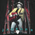 Close-up of front Alan Jackson graphic showing him singing and playing a red guitar