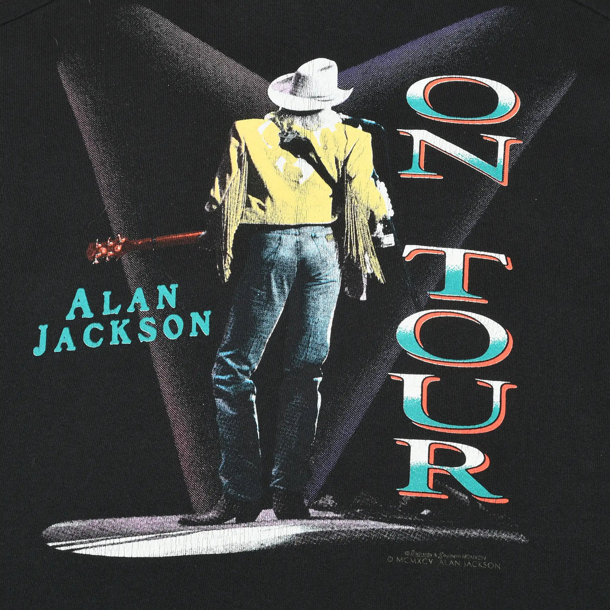 Close-up of back graphic with Alan Jackson under spotlights and large On Tour lettering