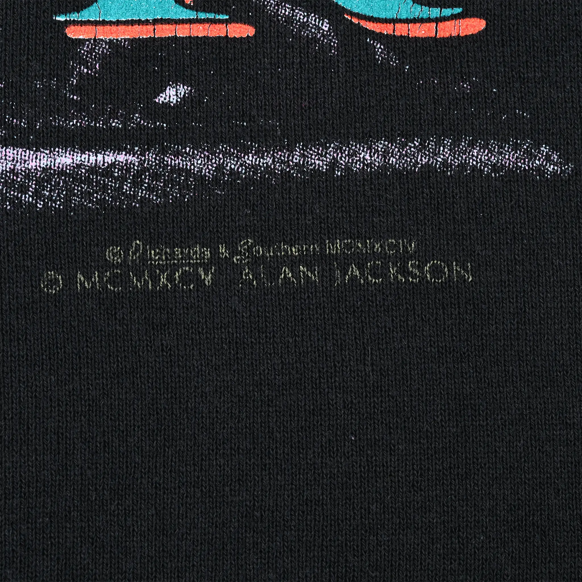 Close-up of copyright text printed beneath the back Alan Jackson tour graphic