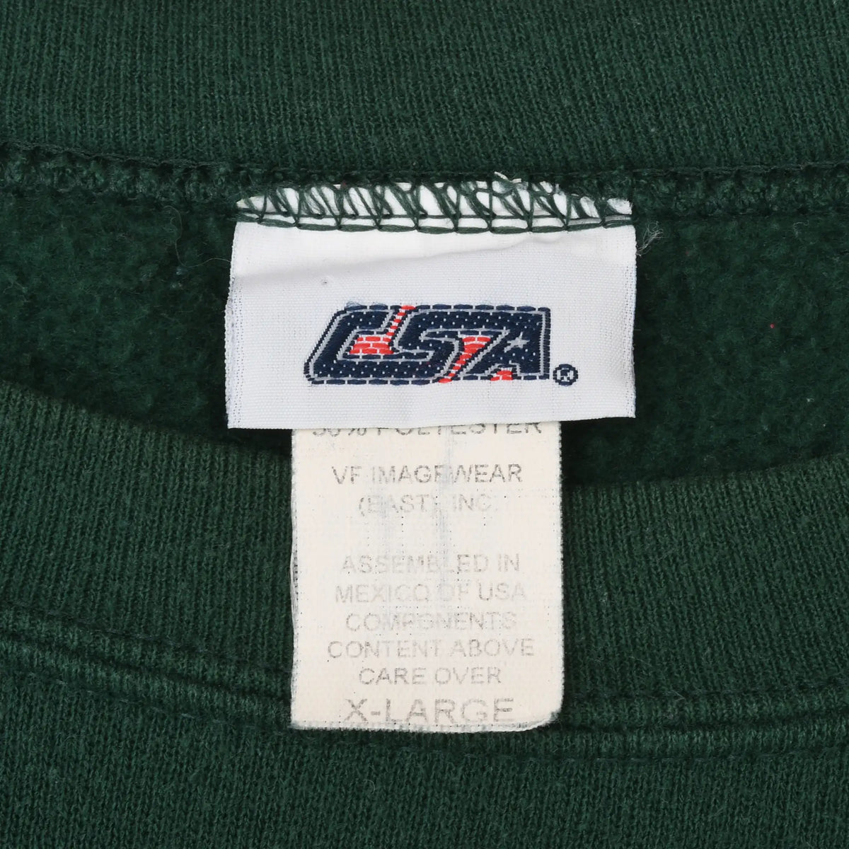 Close-up of USA brand neck tag and X-Large care label inside dark green sweatshirt